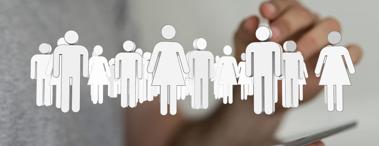 Group of stick figures representing an audience with person on smart device in background Group of stick figures representing an audience with person on smart device in background