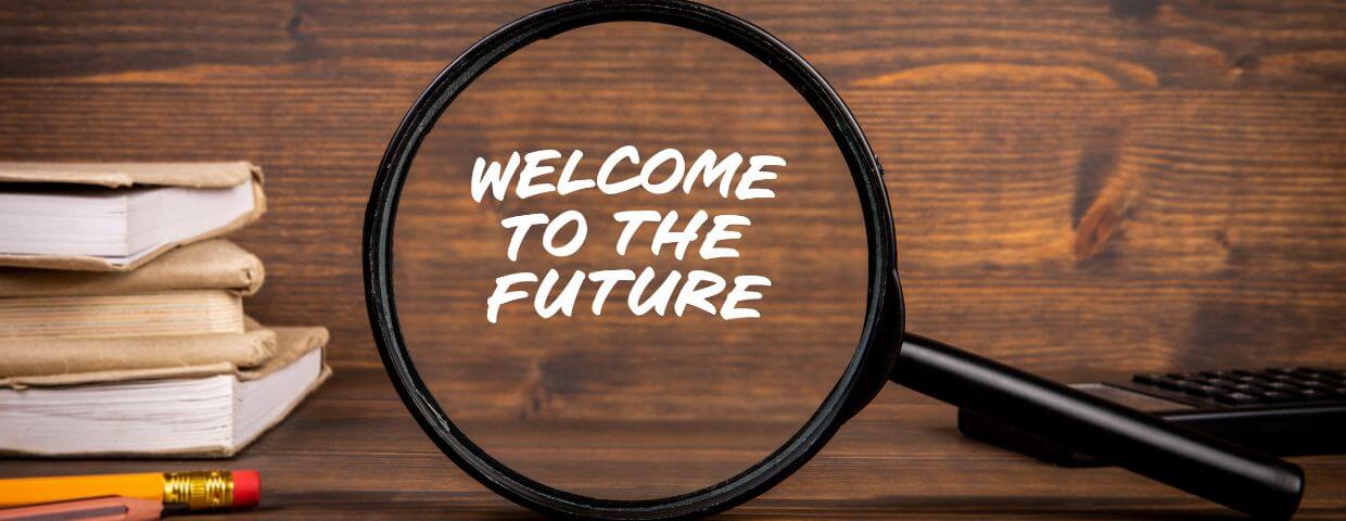 magnifying glass on Welcome to the Future with paper in background magnifying glass on Welcome to the Future with paper in background