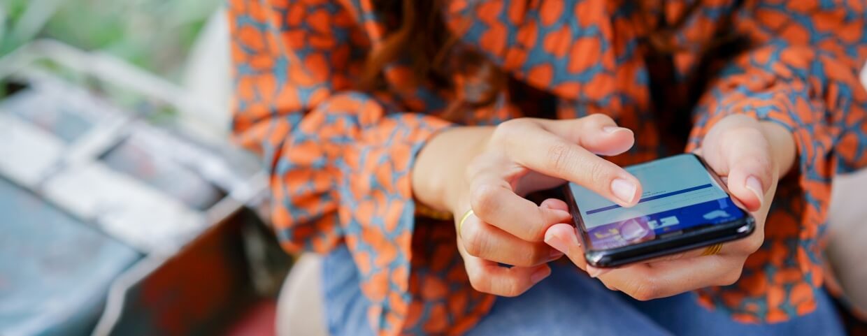 woman submitting Facebook ad woman submitting Facebook ad